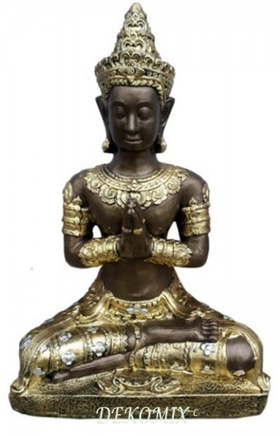 Betender Thai Buddha im Schneidersitz sitzend 
